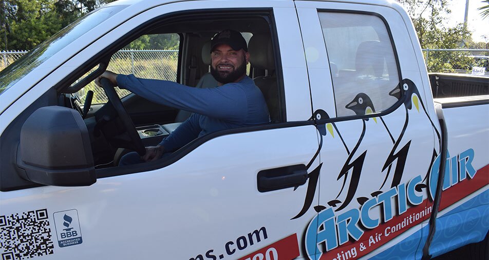 Arctic Air Worker in Van Smiling 